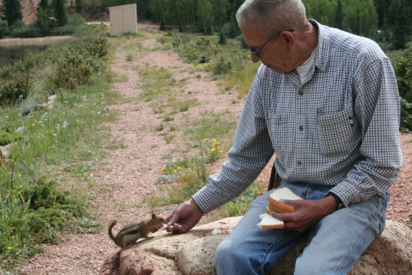 Dad feeding a chipmunk while on duty as Bison Reservoir caretaker, c. 2007.